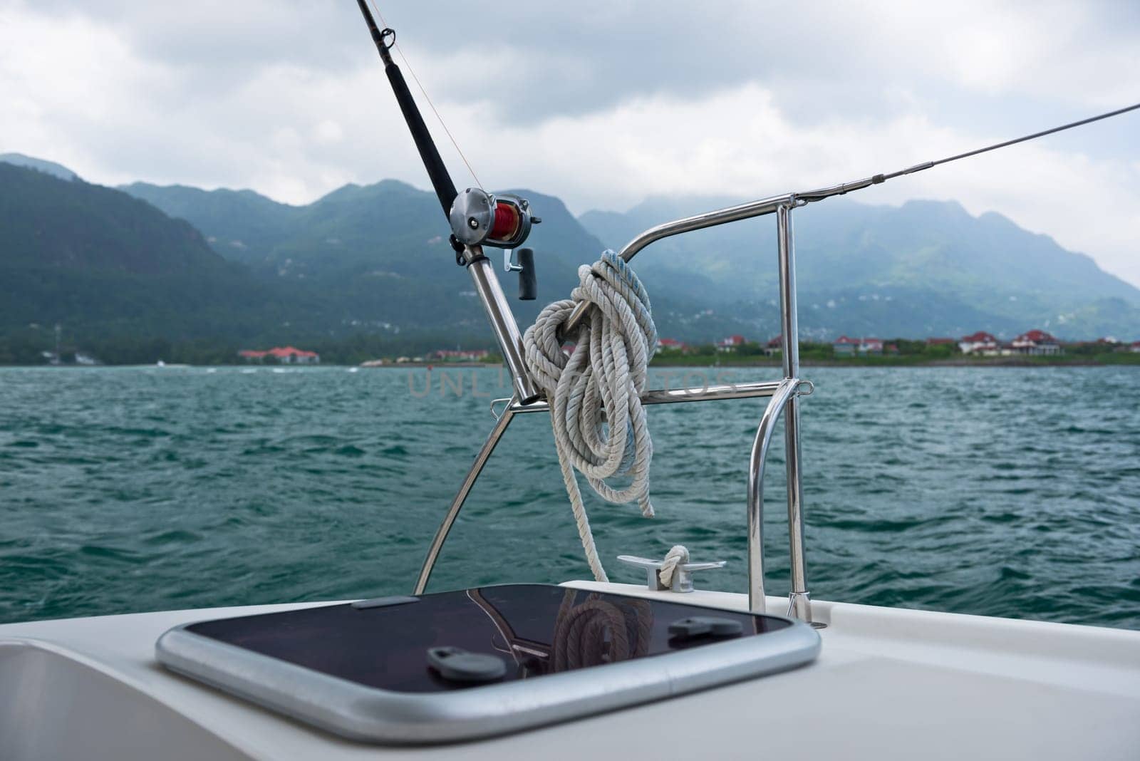Fishing rod and reel on a sailing yacht. Horizontal shot