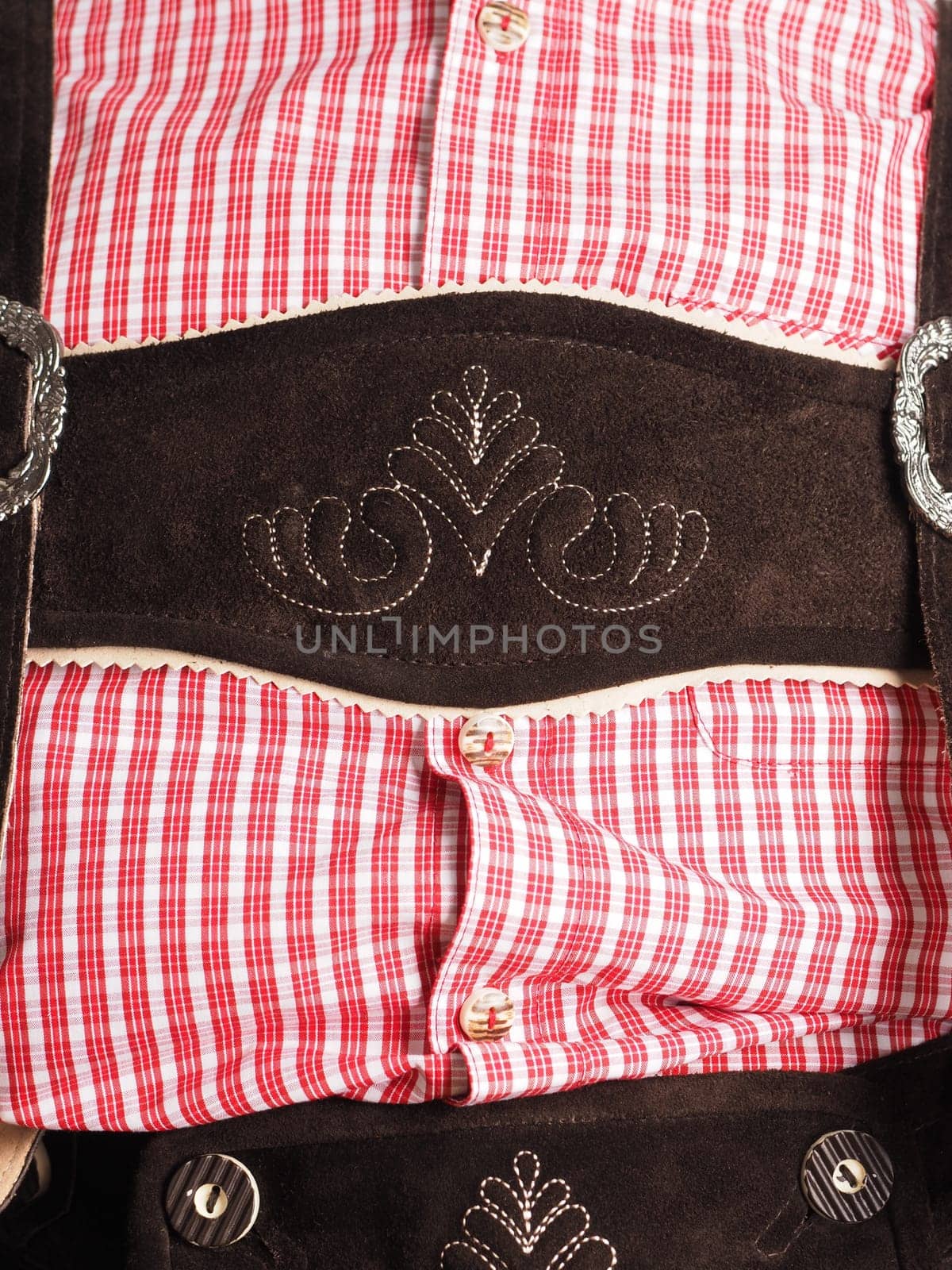Close-up of lederhosen with traditional shirt in check pattern, Oktoberfest concept, Bavarian clothing
