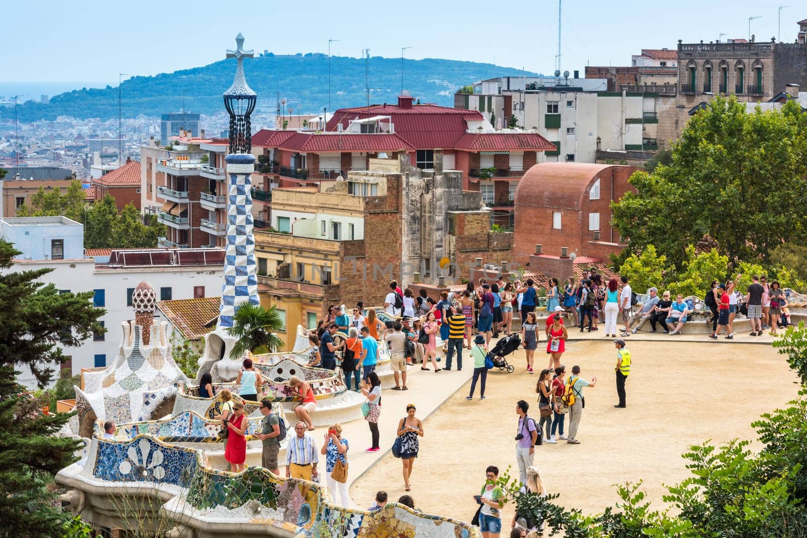 SPAIN, BARCELONA - SEPTEMBER 13: Tourists in Park Guell, Barcelona, Spain on September 13, 2015