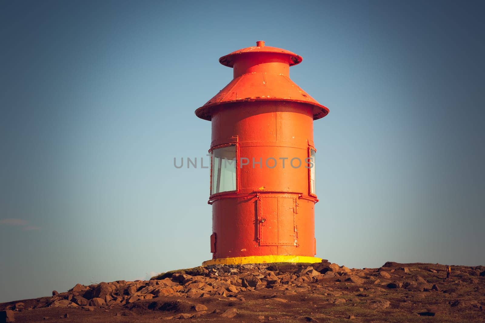 Red Lighthouse on a hill above Stykkisholmur, the western part of Iceland