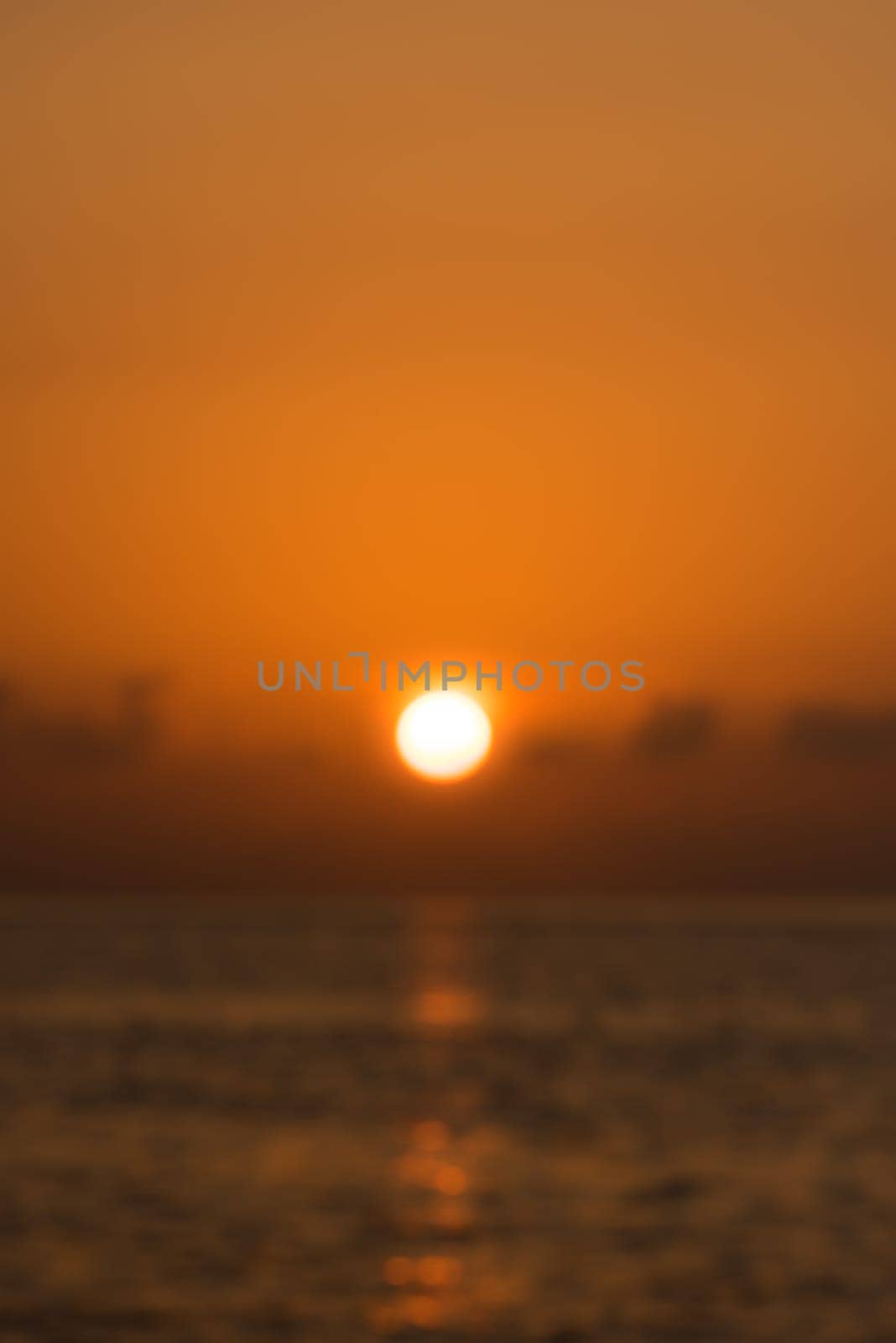 Defocused tropical sunset background. Blur abstract shot