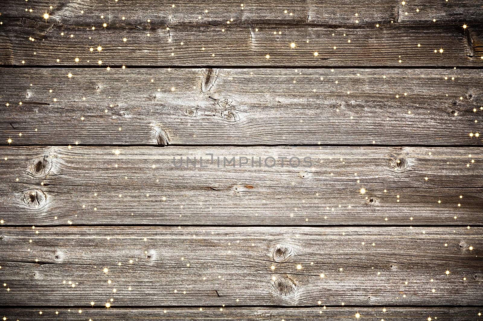 Old wooden planks surface background with golden sparkles