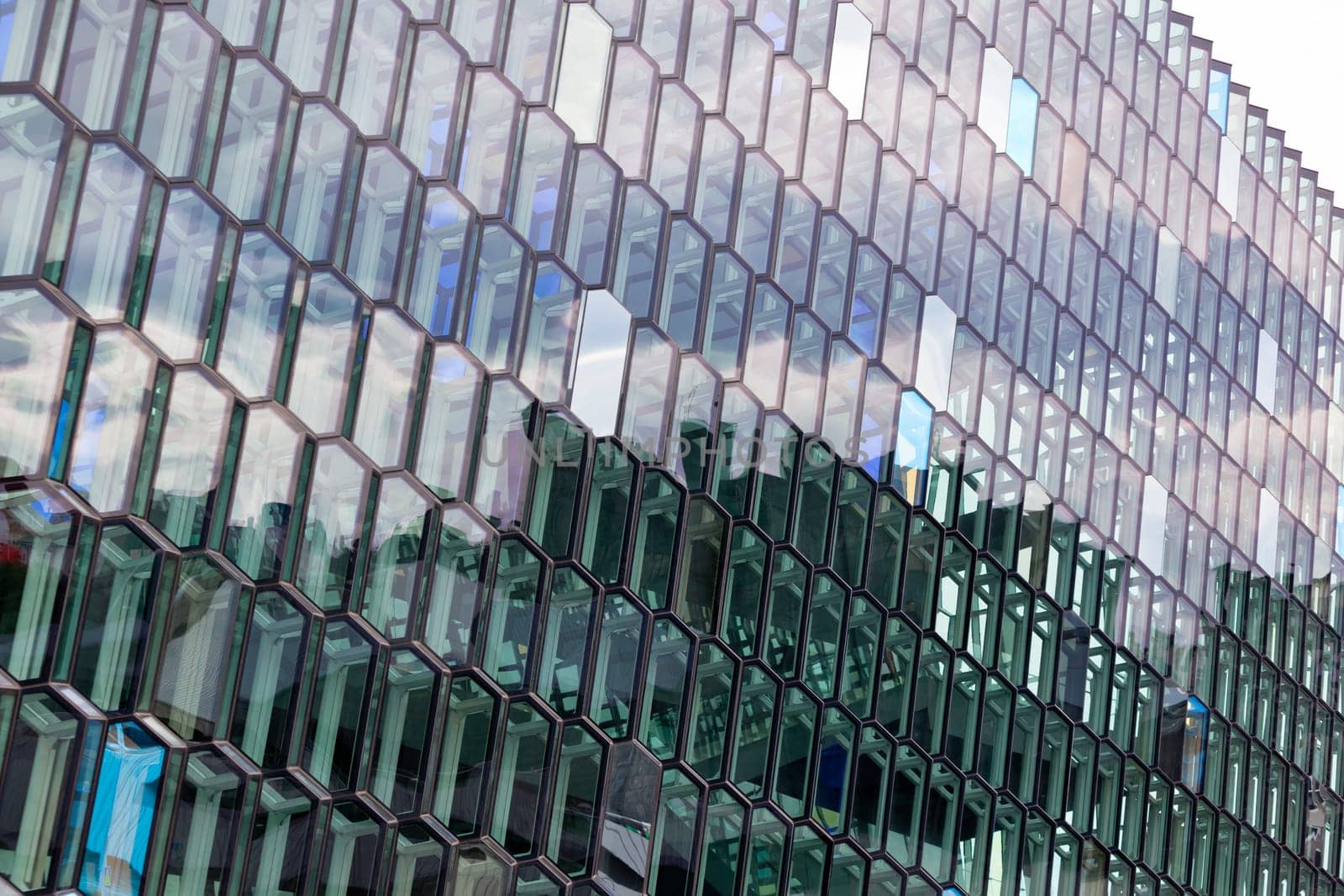 Detail of the glass facade of the Harpa Concert Hall in Reykjavik, Iceland.