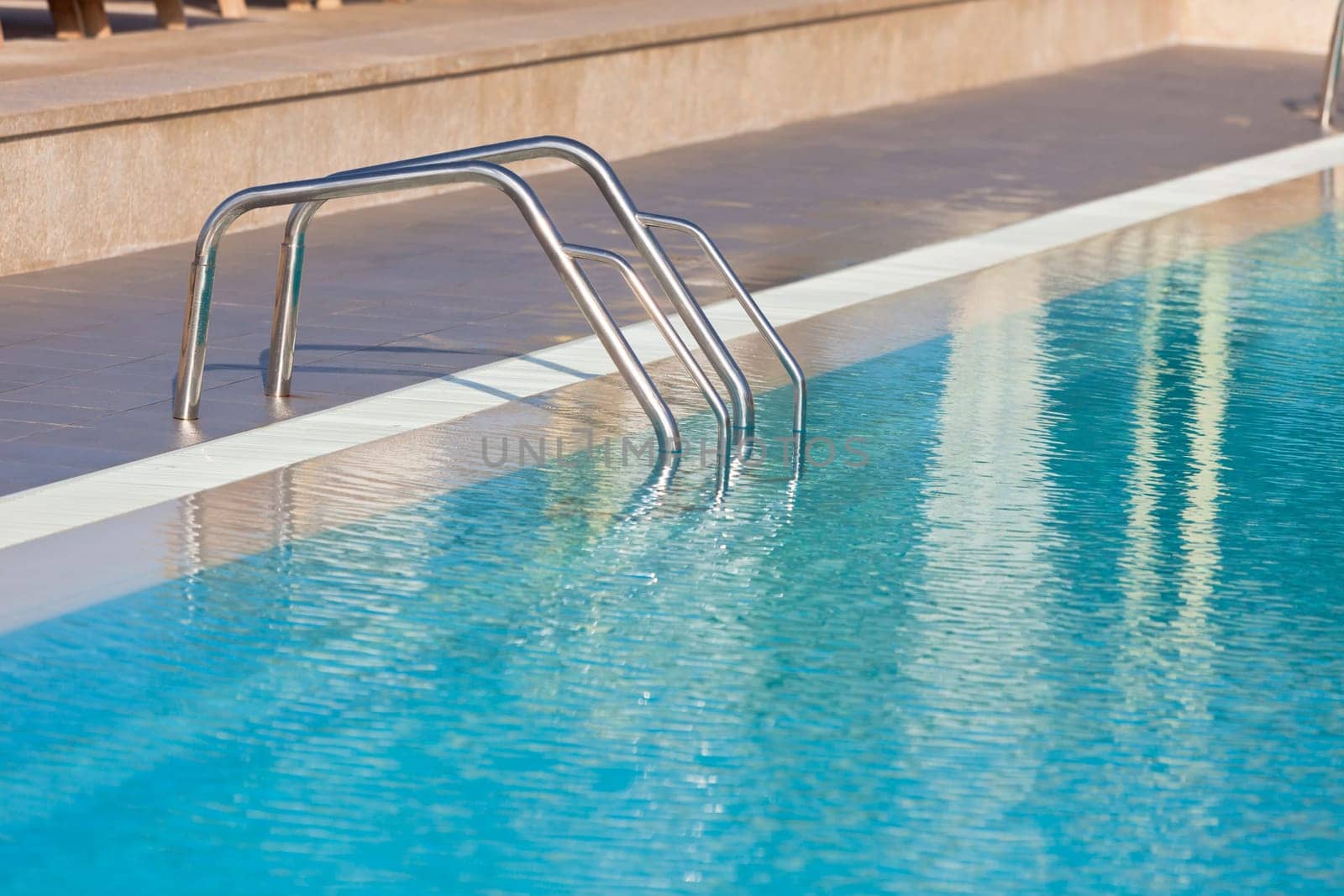 Ladder of a swimming pool. Horizontal shot