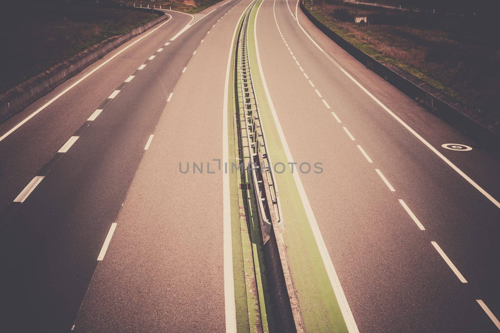 Highway through France at summer time. Top view. Filtered shot