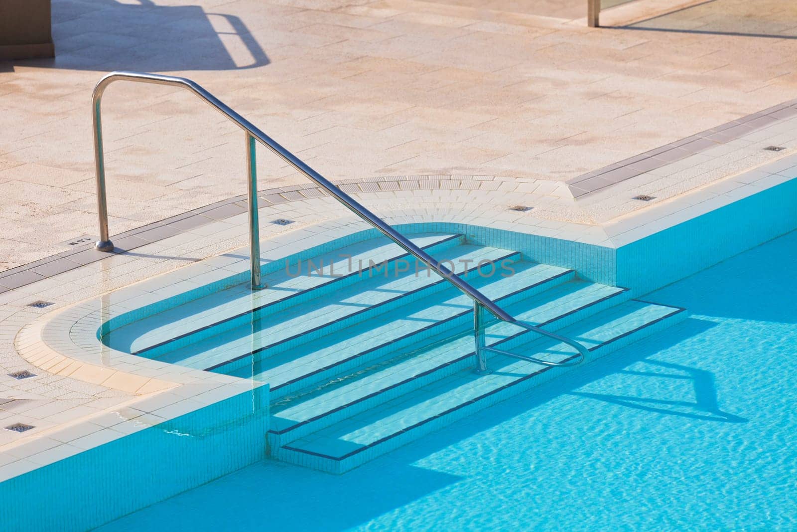 Outdoor Swimming pool with staircase. Horizontal shot
