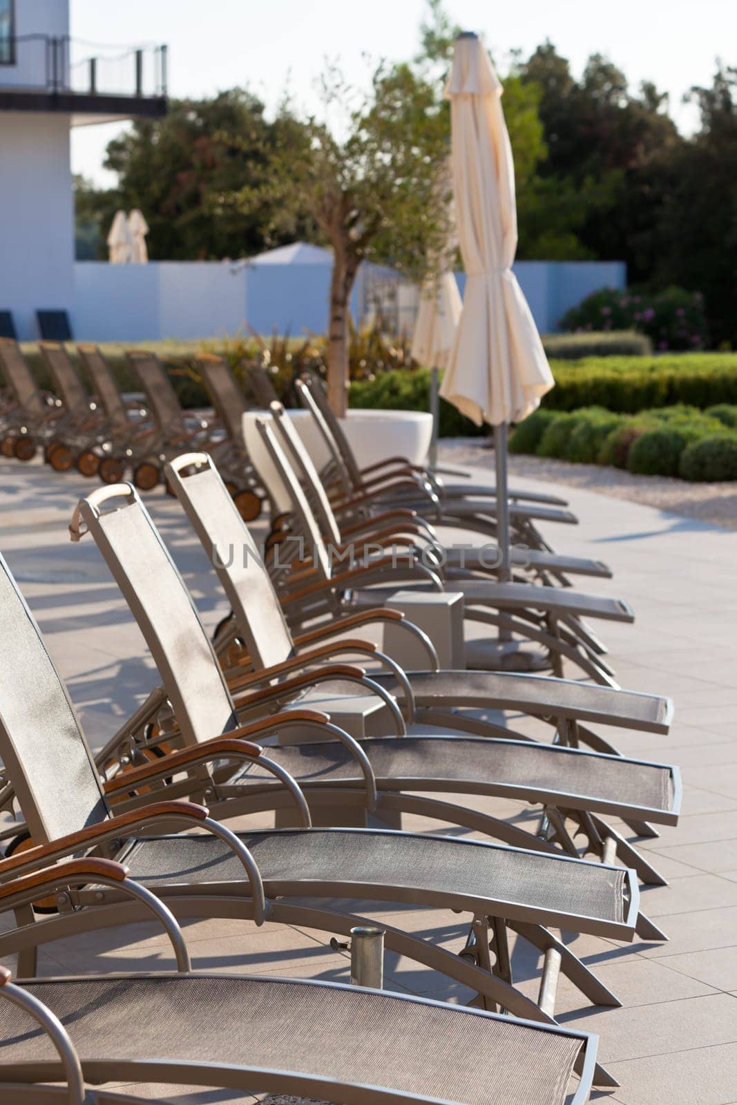 Hotel Poolside Chairs Row. Vertical shot