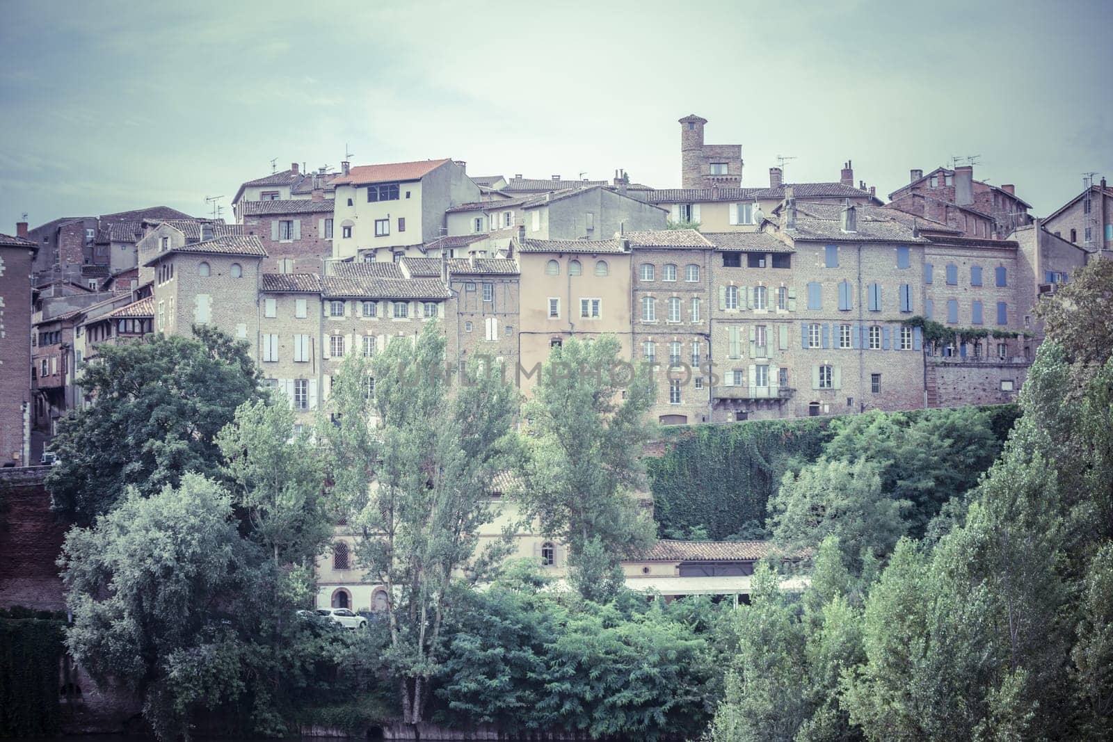 Cityscape with old houses in Albi, France. Horizontal filtered shot