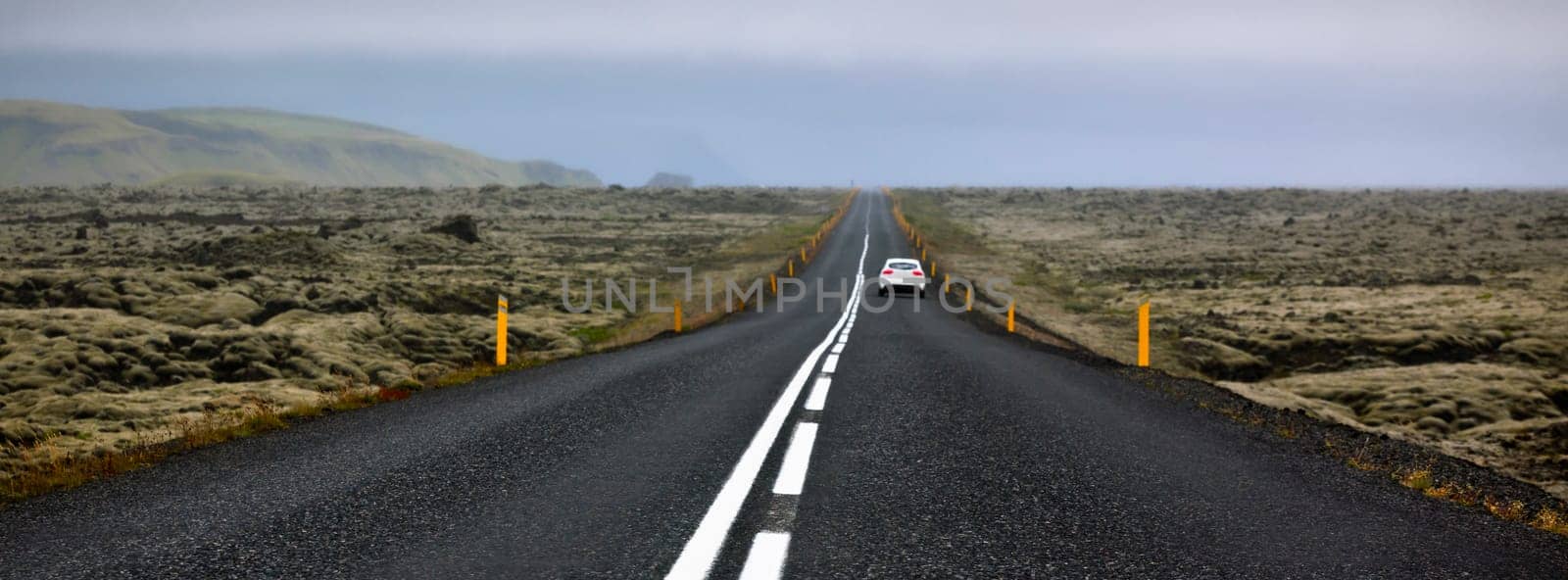 Highway N1 through Iceland landscape at foggy day. Long banner