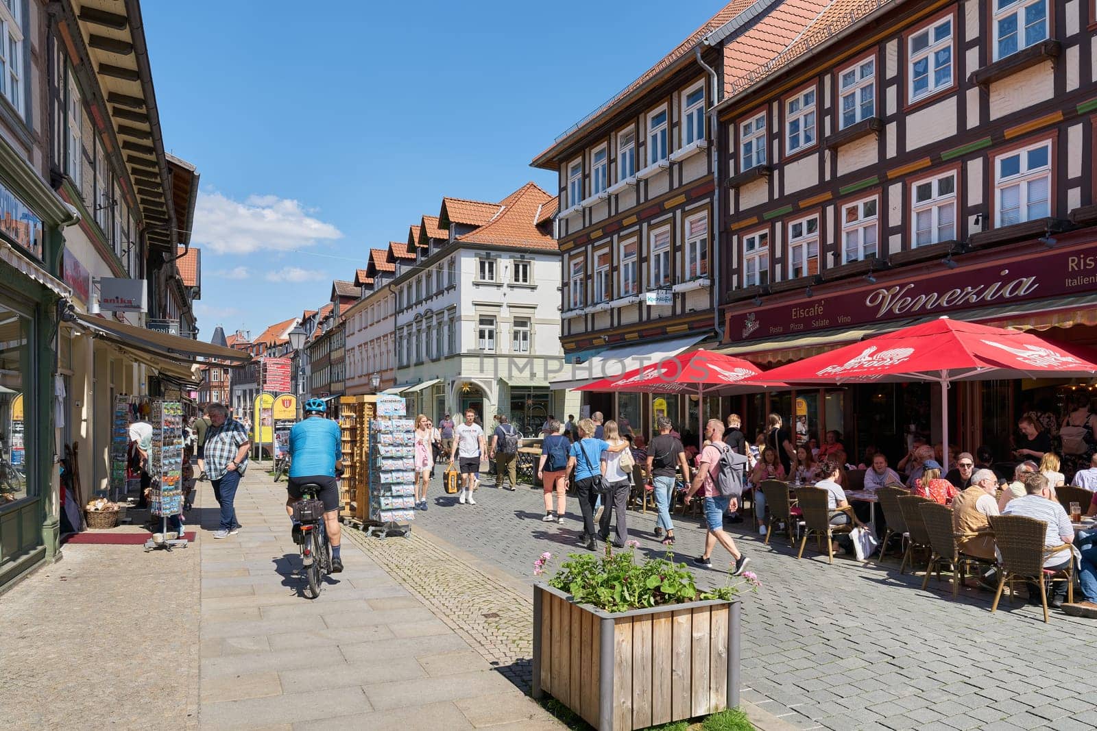 Tourists in a shopping street in the old town of Wernigerode in the Harz Mountains in Germany