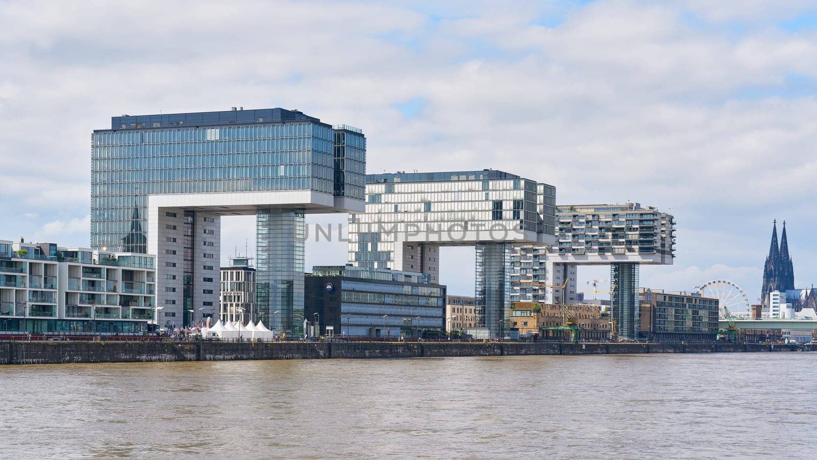 modern residential buildings, crane houses, Kranhaus in the Rheinauhafen in Cologne, seen from the water