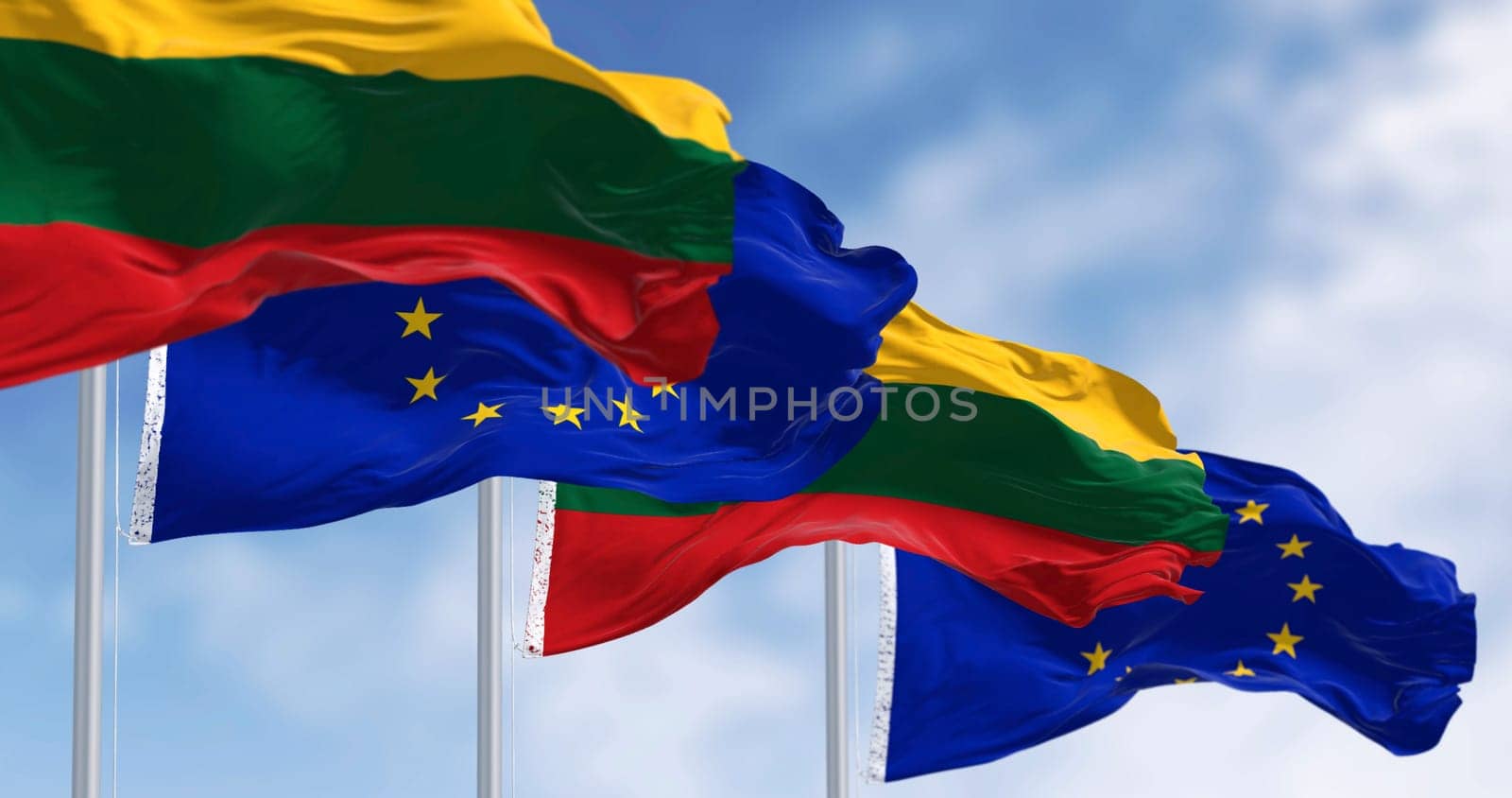 Flags of Lithuania and the European Union waving together on a clear day. Lithuania became a member of the European Union on 2004. 3D illustration render. Rippled fabric. Selective focus