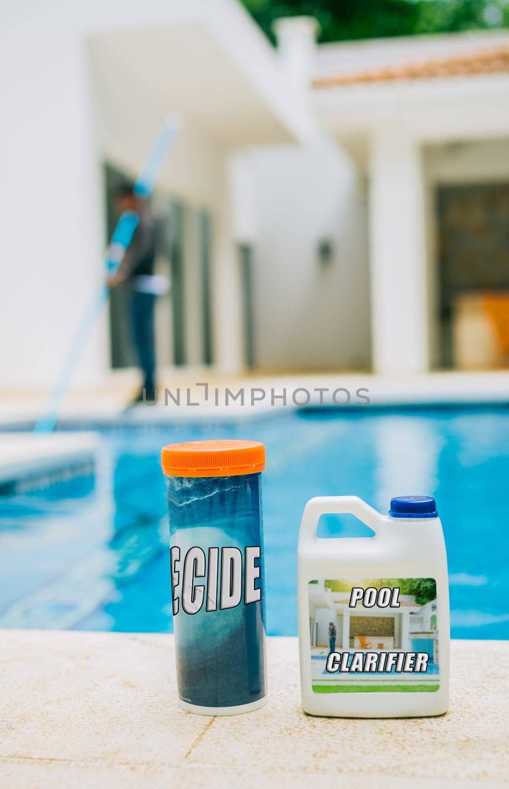 Algaecide and clarifier for swimming pools. Clarifying chemical at the edge of a swimming pool