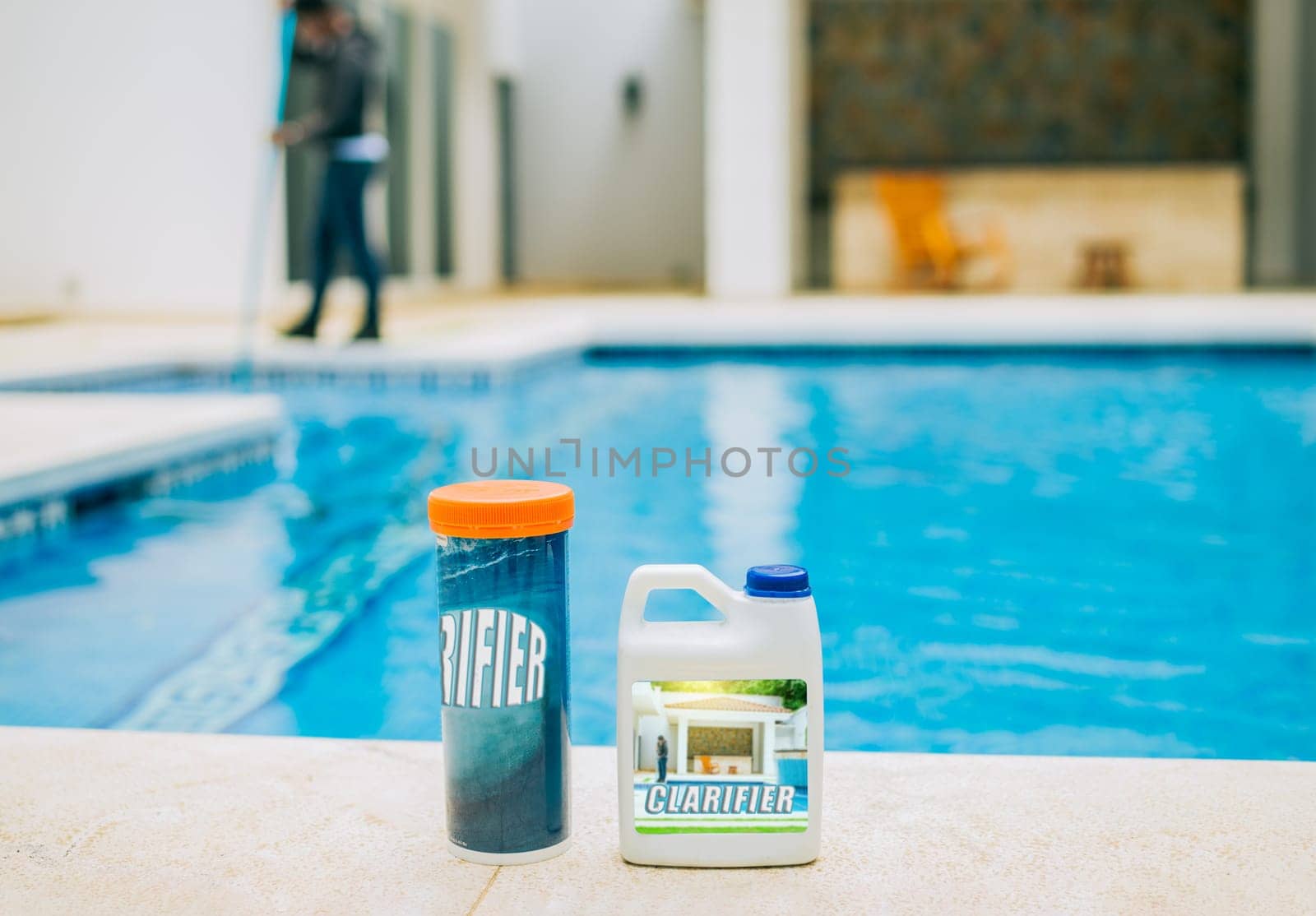 Clarifier for cleaning swimming pools. Clarifying chemical at the edge of a swimming pool