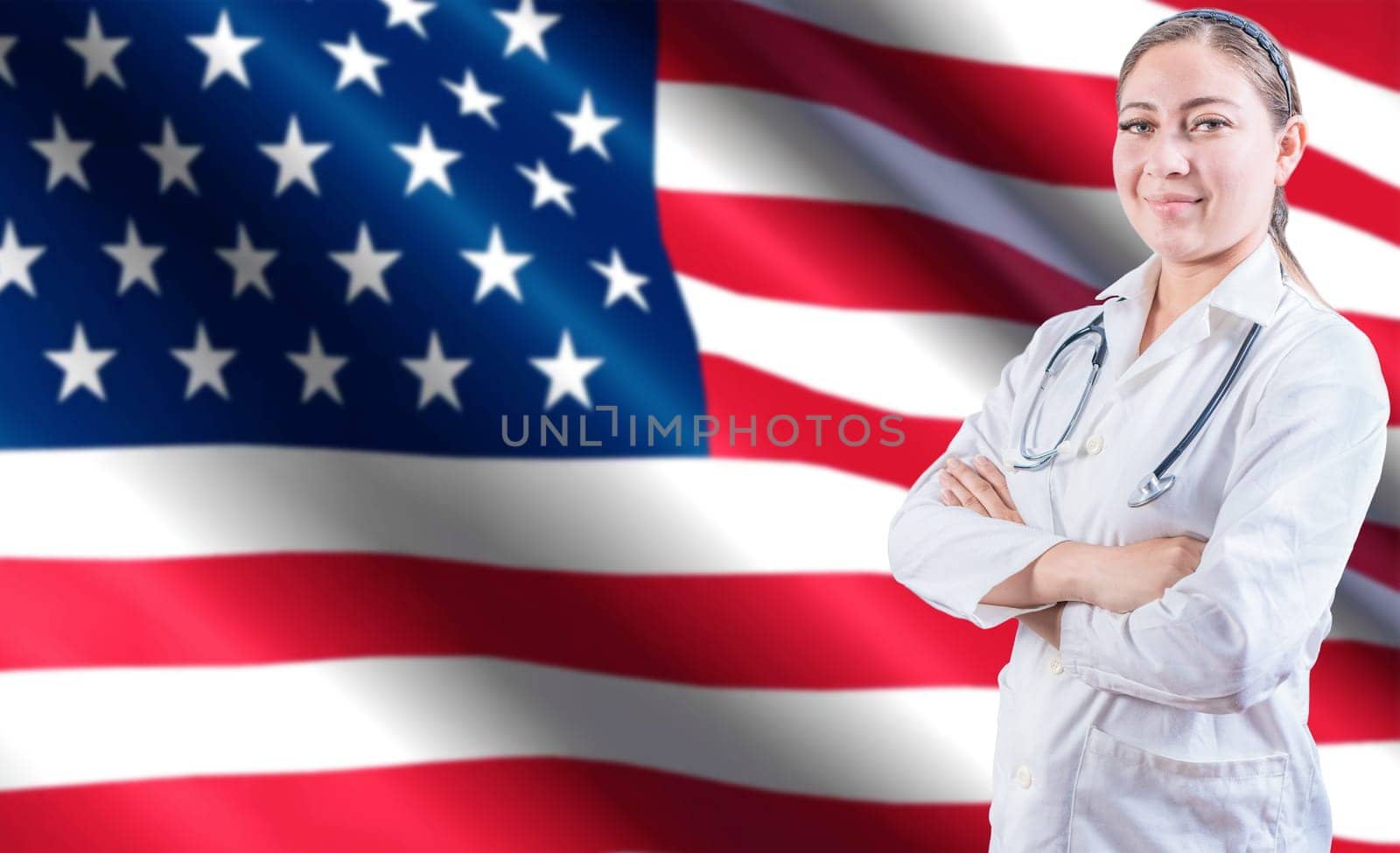 Portrait of female doctor with crossed arms with USA flag in the background. Health and care with flag of United State