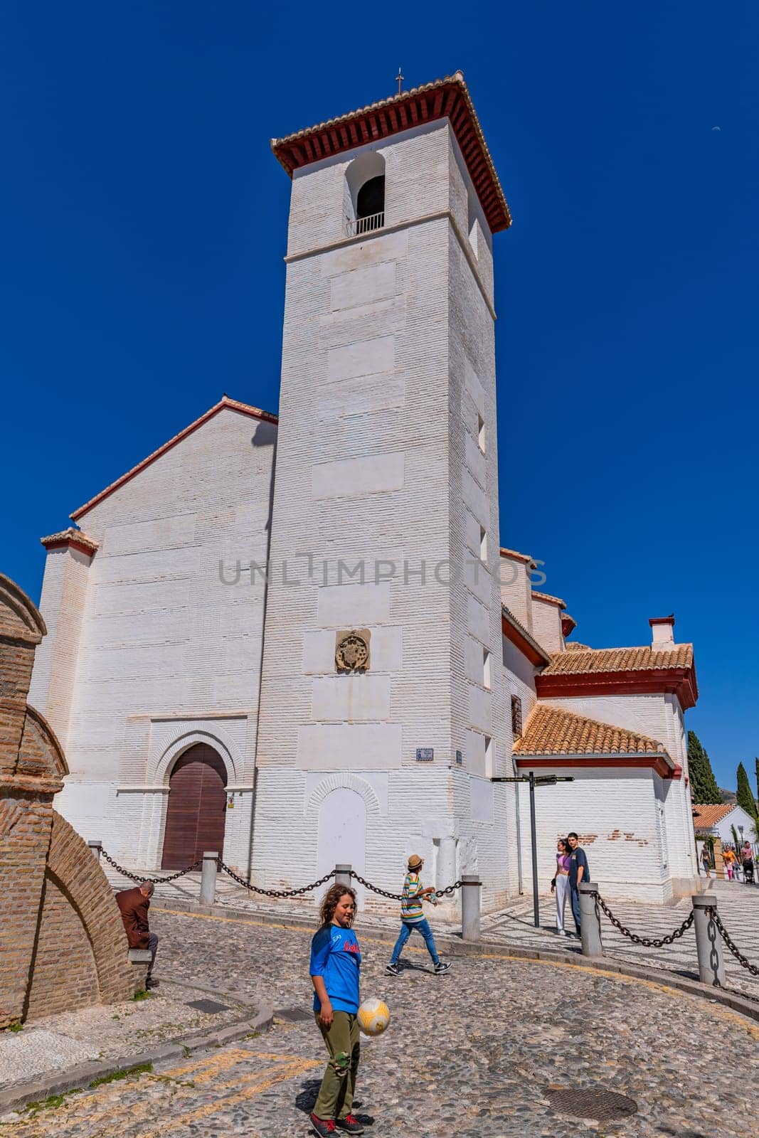 Granada, Spain: April 15, 2024: People at the Albaicin Moorish medieval quarter, traditional arabic architecture of Andalusia. Granada, Spain