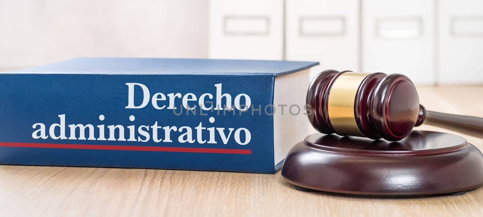 A law book with a gavel - Administrative law in spanish