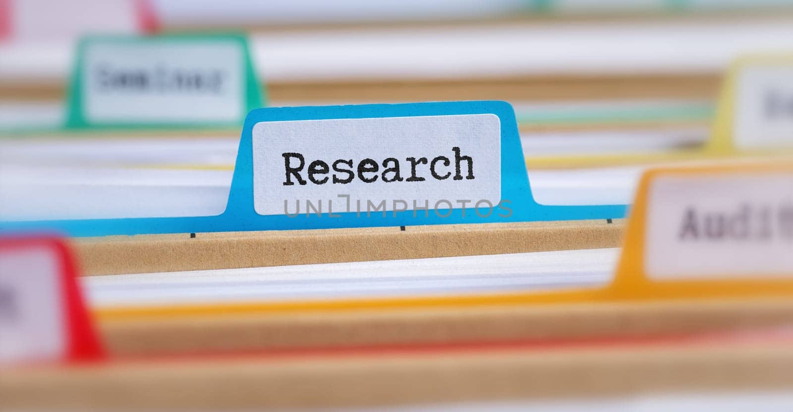 File folders with a tab labeled Research