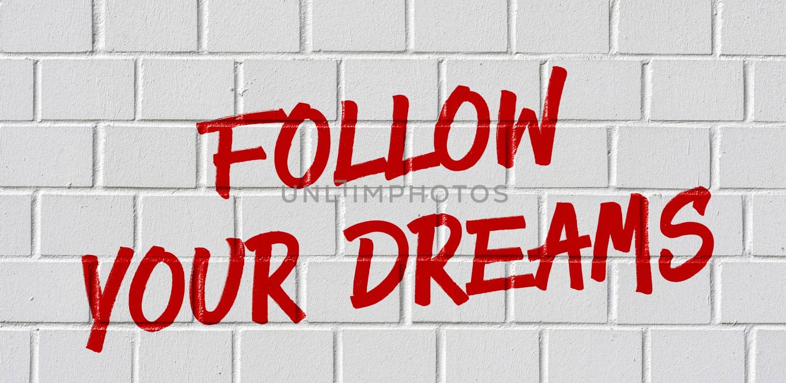 Graffiti on a brick wall - Follow your dreams