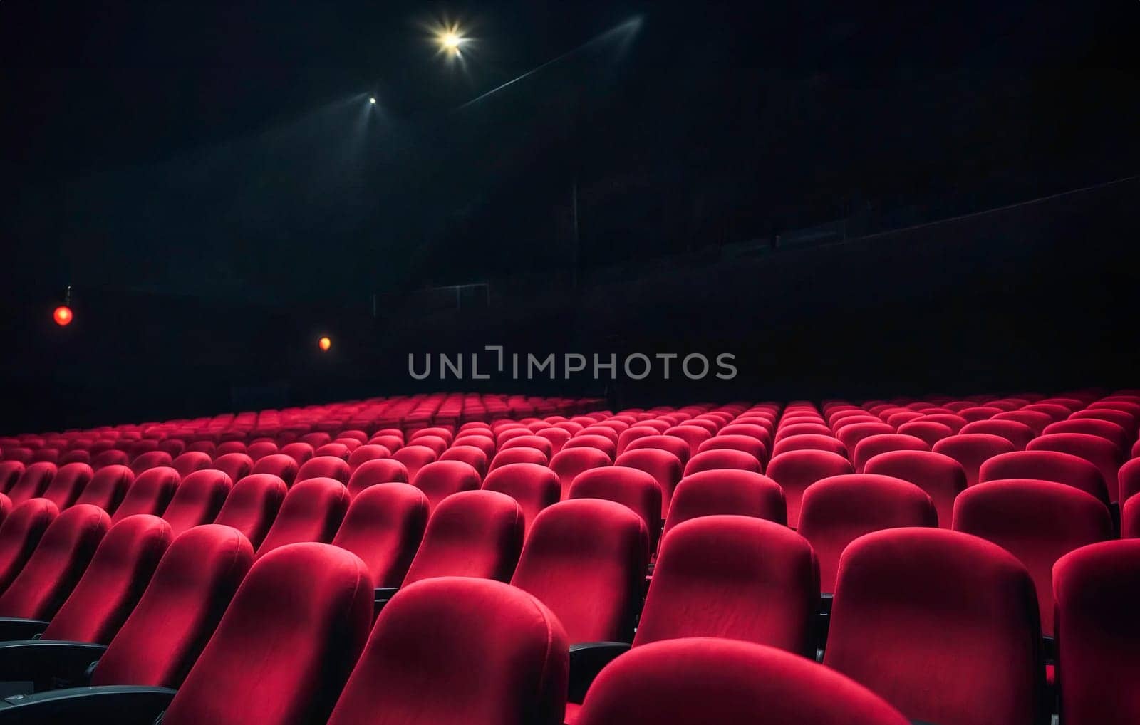 An empty theater auditorium with rows of red seats and dim lighting, capturing a quiet and dramatic atmosphere