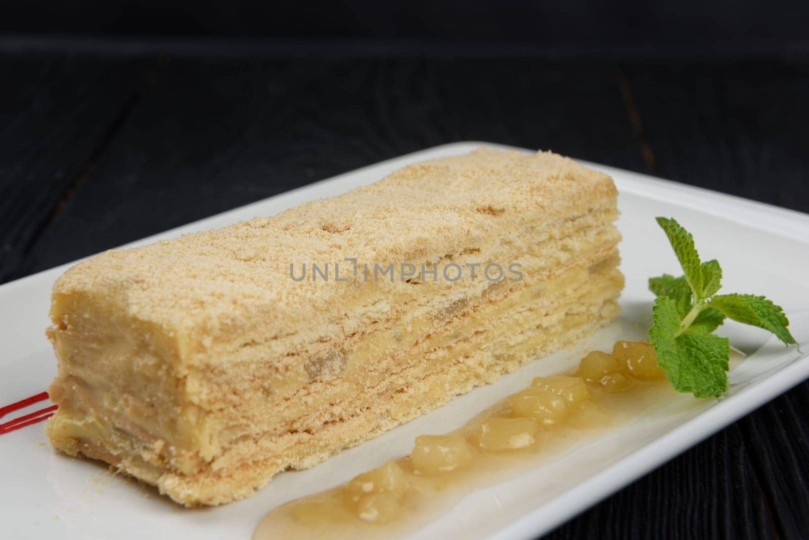 Esterhazy traditional cake on a white plate with mint
