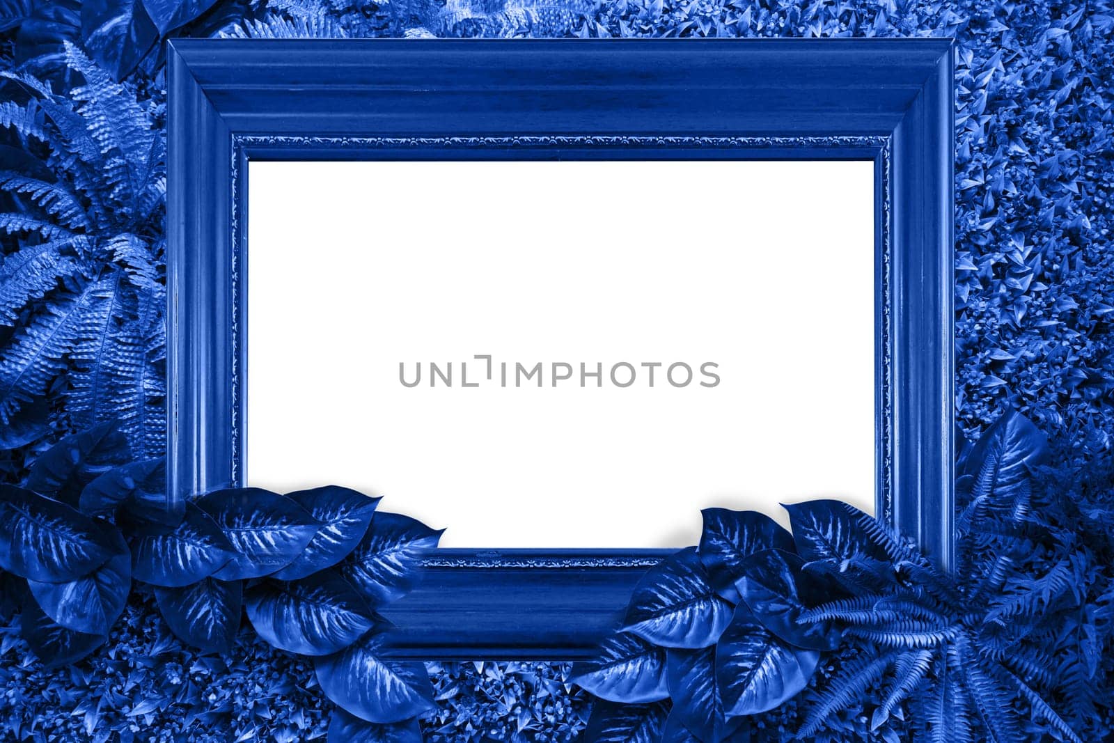 Classic blue color background from leaves and white blank for your design or text. Pantone color of the year 2020.