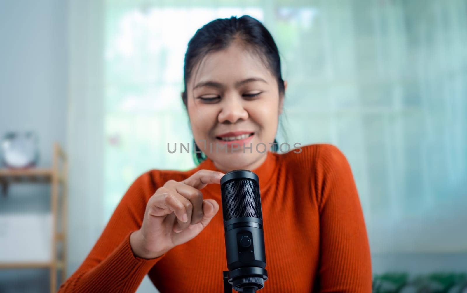Woman talking into microphone on stand, lead on-line communication, discuss topic, virtual meeting event, Podcast, webinar, Content creator concept, live on social media, Recording podcast.