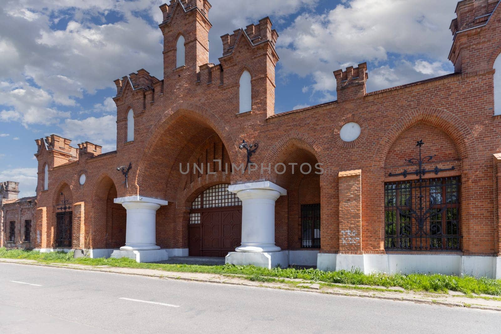 Lodz, Poland - May 4, 2023: Neo-gothic red brick gate Grohmann kegs at Targowa Street, entrance to the 19th century Grohman textile factory
