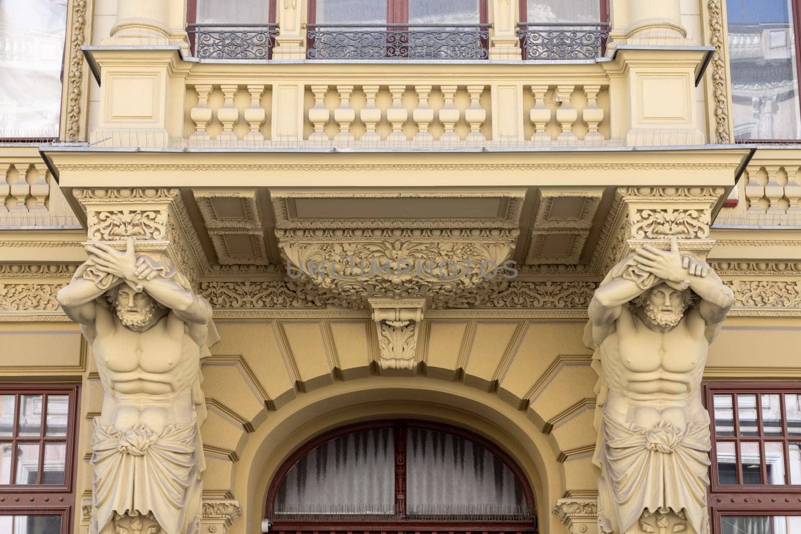 Lodz, Poland - May 4, 2023: Tenement house of Herman Konstadt, located on Piotrkowska street. Decorative facade with statue of atlas