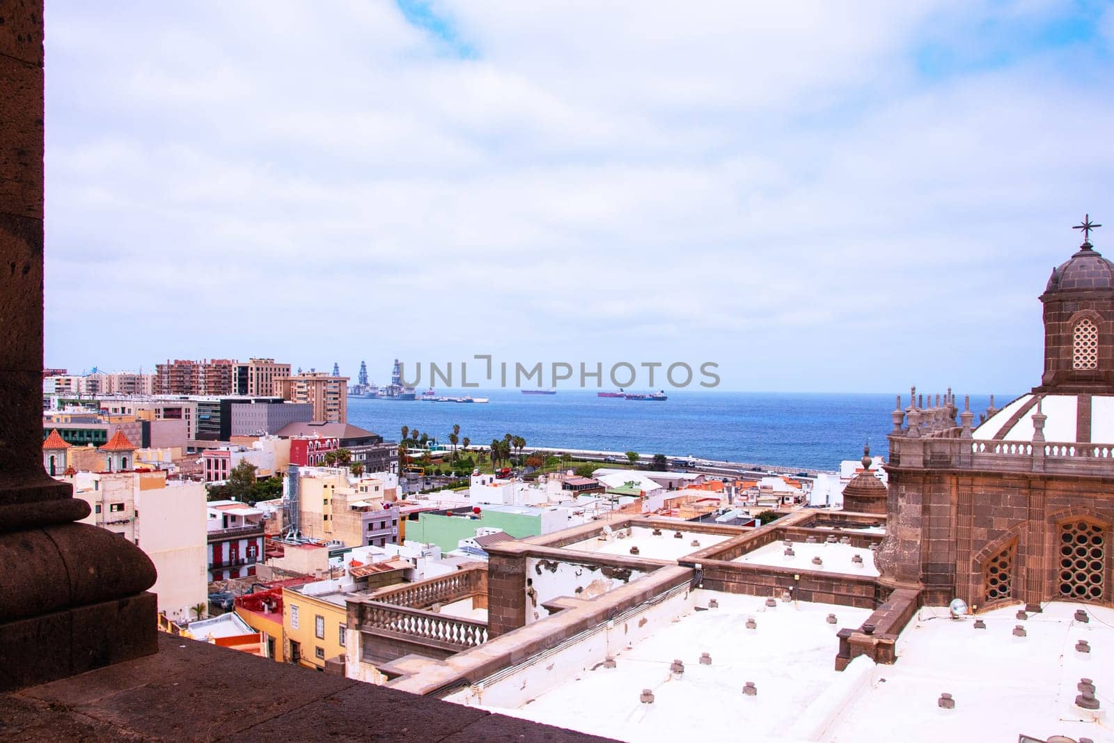 Gran Canaria, Spain, Canary Islands. View of the city of Las Palmas with part of the Santa Ana Cathedral, to the harbor and the sea from the belltower of the Cathedral.