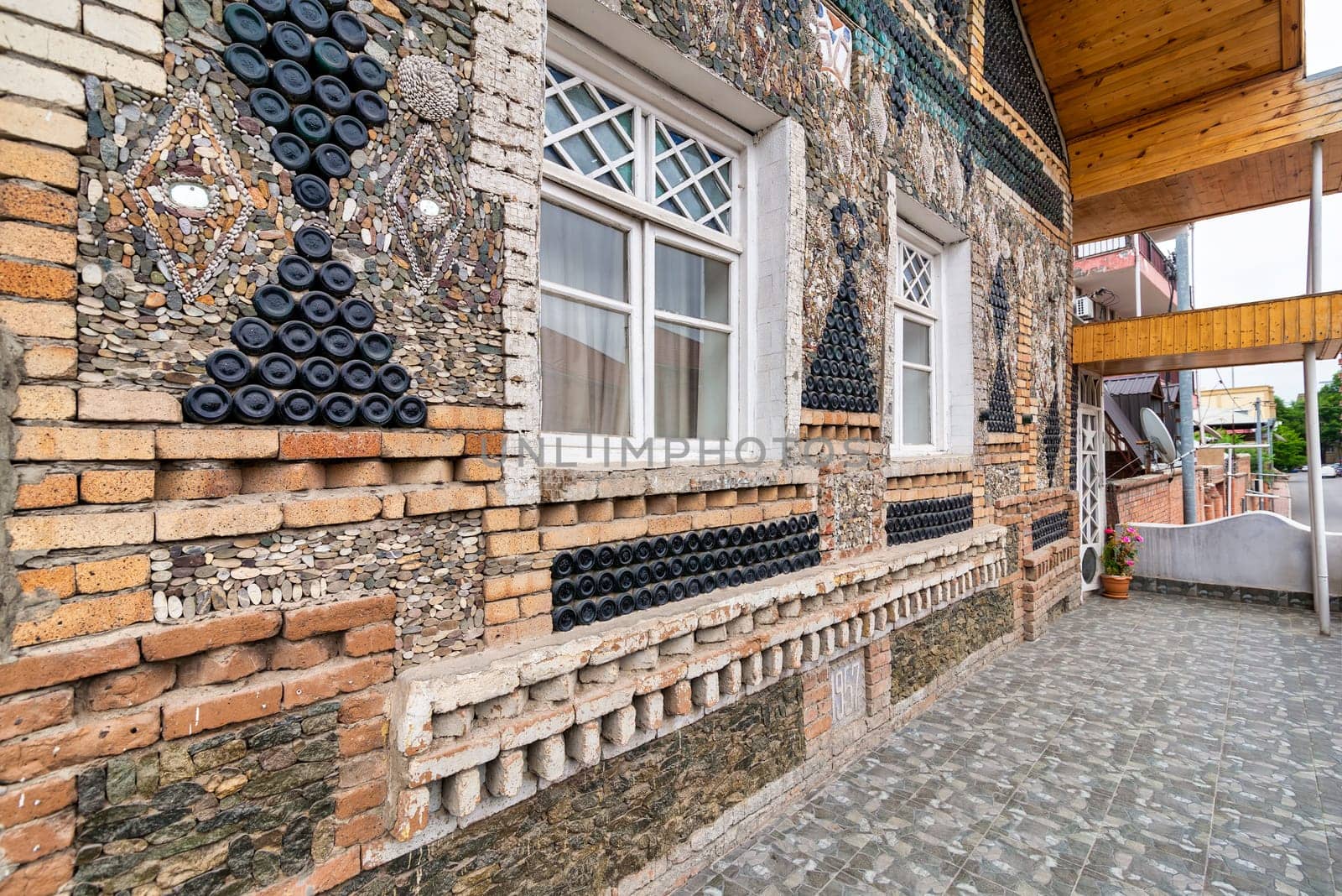 The Bottle House in Ganja features an intricate design made from glass bottles and local materials, attracting visitors with its creative architecture and vibrant exterior
