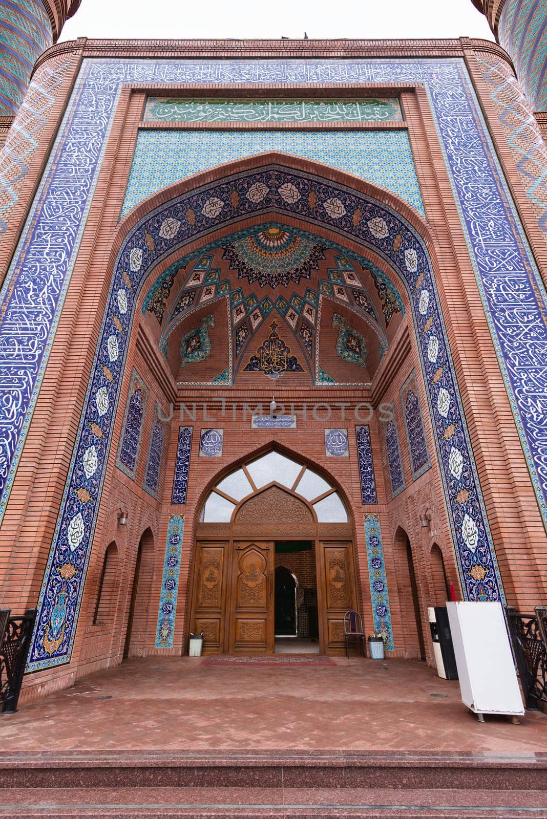 The stunning entrance of the Imamzadeh Mausoleum in Ganja, Azerbaijan, showcasing vibrant tile work, brickwork, and unique architectural details that reflect the region's rich history