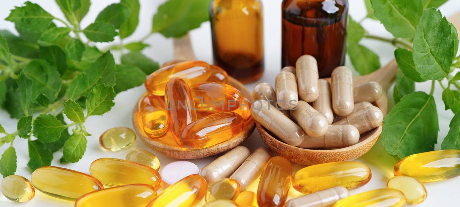 Alternative medicine herbal organic capsule with vitamin E omega 3 fish oil, mineral, drug with herbs leaf natural supplements for healthy good life.