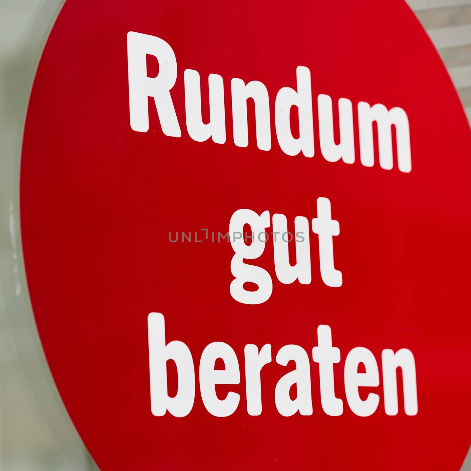 Sticker on a shop window with the german inscription Rundum gut beraten. Translation: Good advice all round