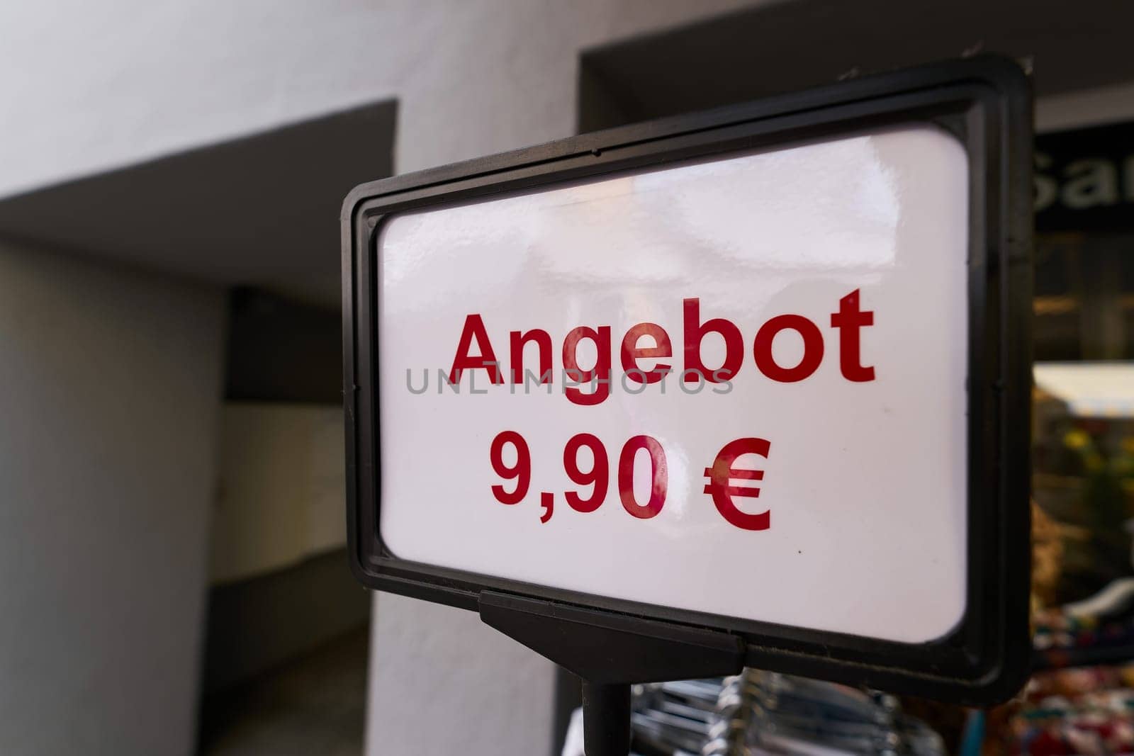 Sign advertising a special offer of 9.90 euros outside a store in Germany. Translation: special offer of 9.90 euros
