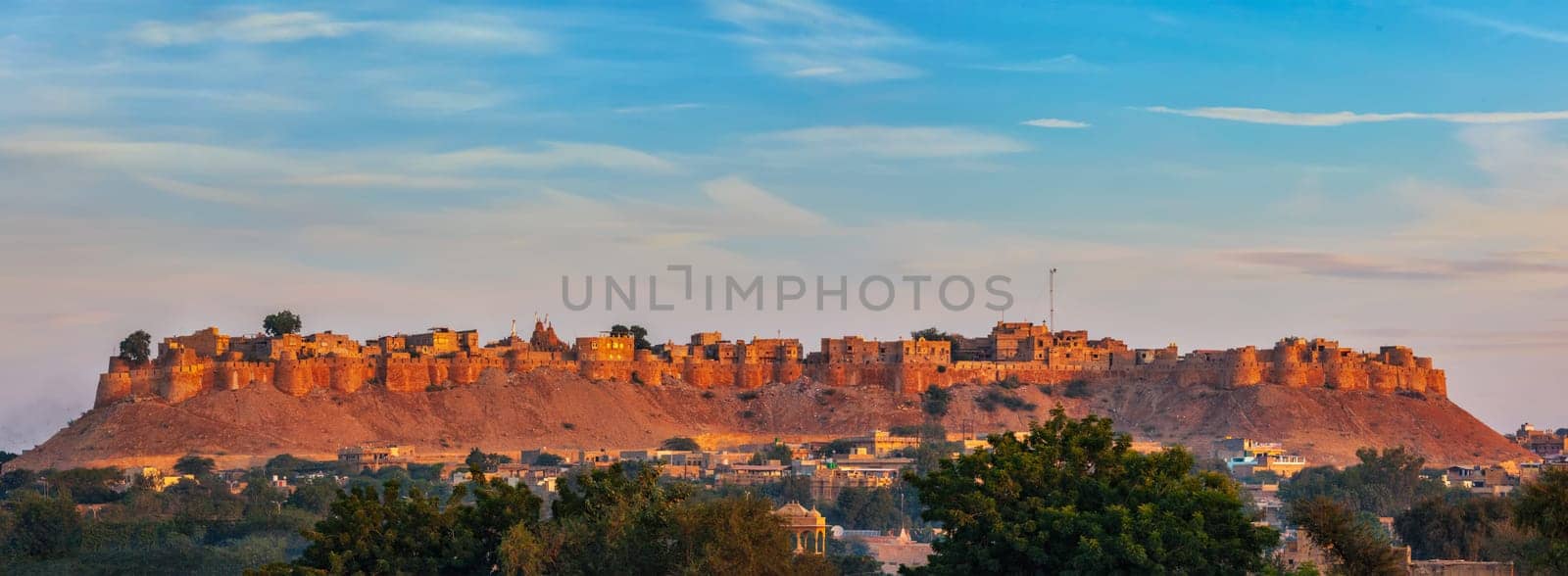 Panorama of Jaisalmer Fort - one of the largest forts in the world, known as the Golden Fort Sonar quila on sunrise. Jaisalmer, Rajasthan, India