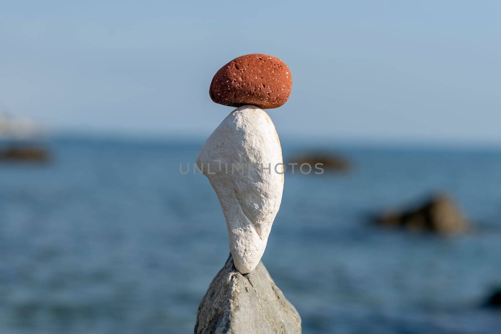 balanced stones on the rocks of the sea