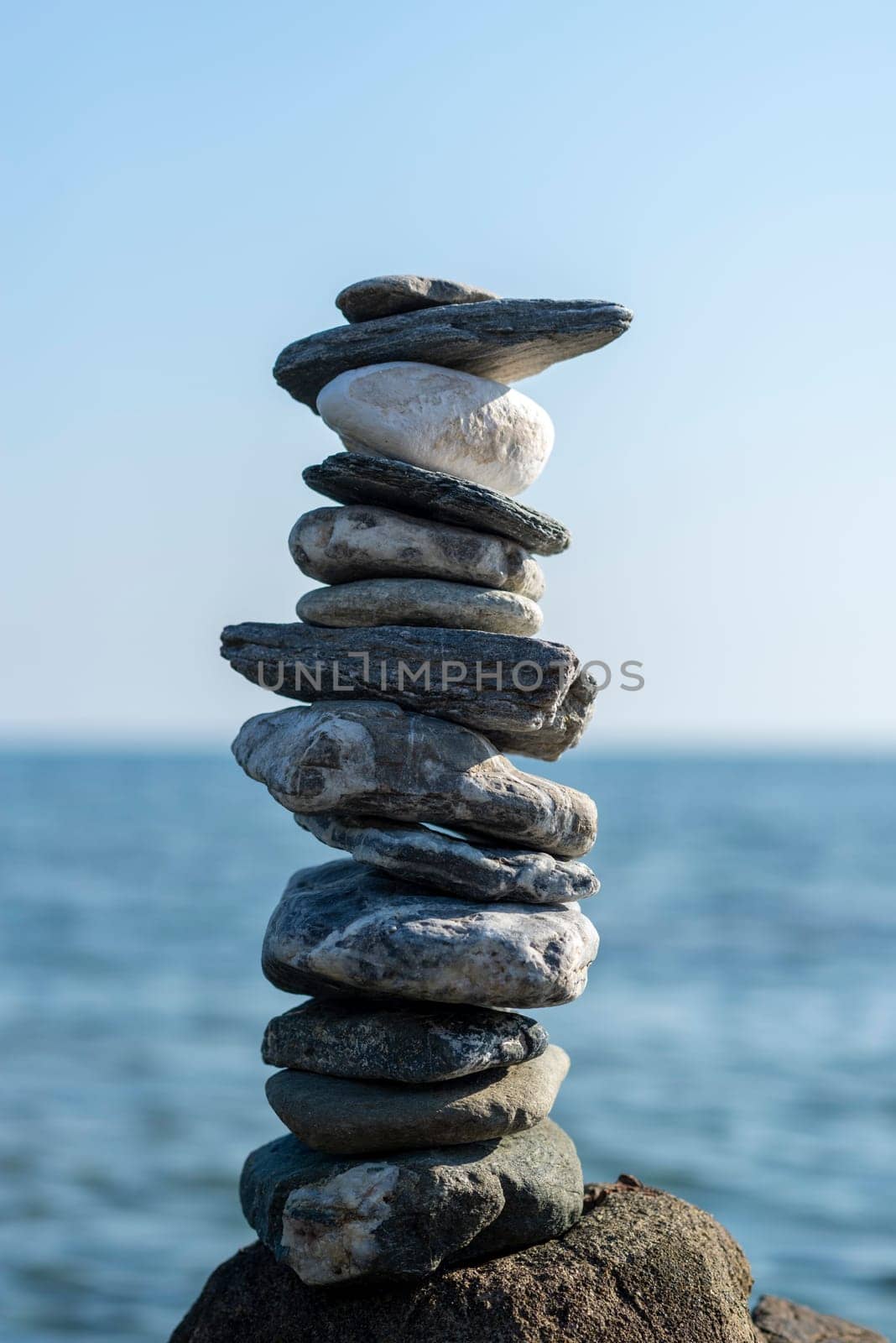 balanced stones on the rocks of the sea