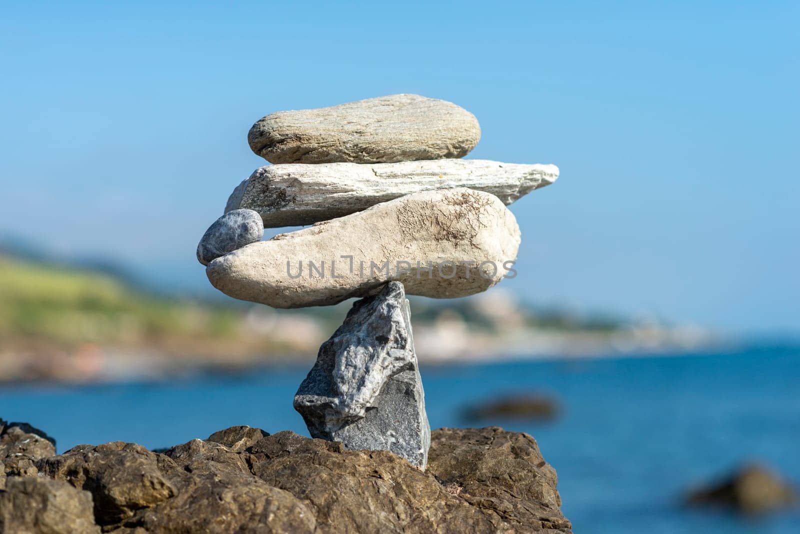 balanced stones on the rocks of the sea
