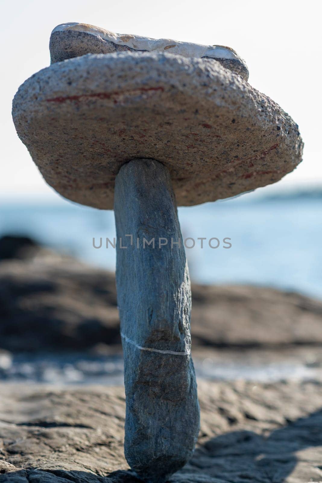 balanced stones on the rocks of the sea