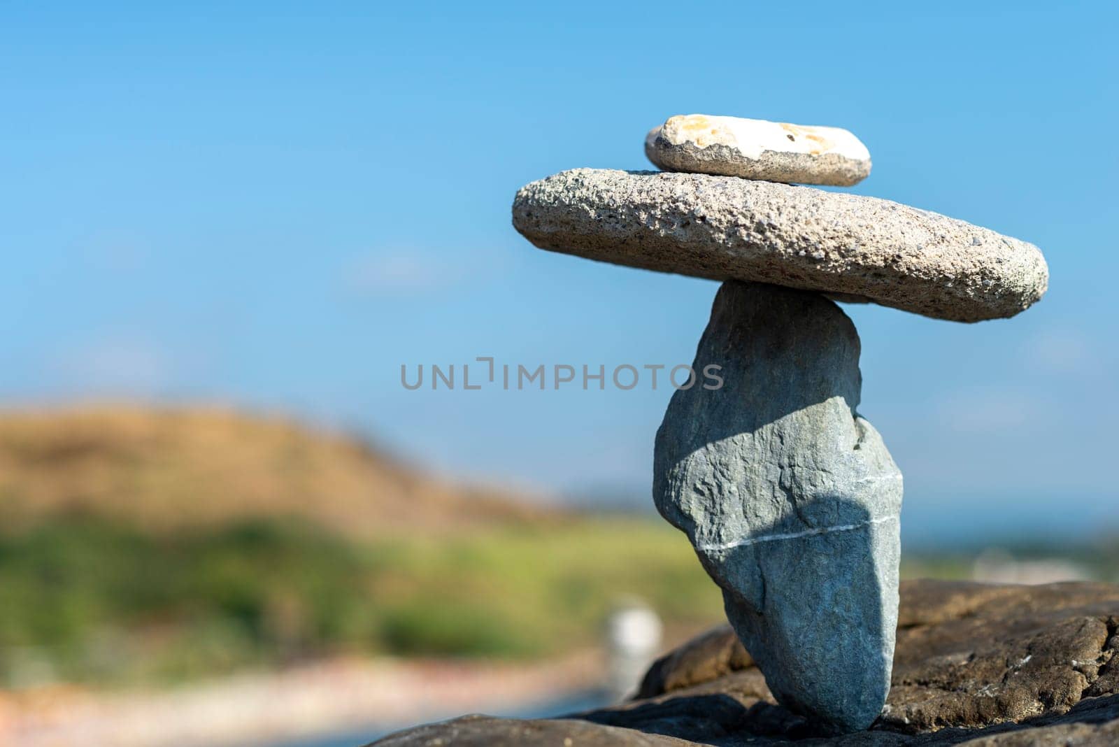 balanced stones on the rocks of the sea