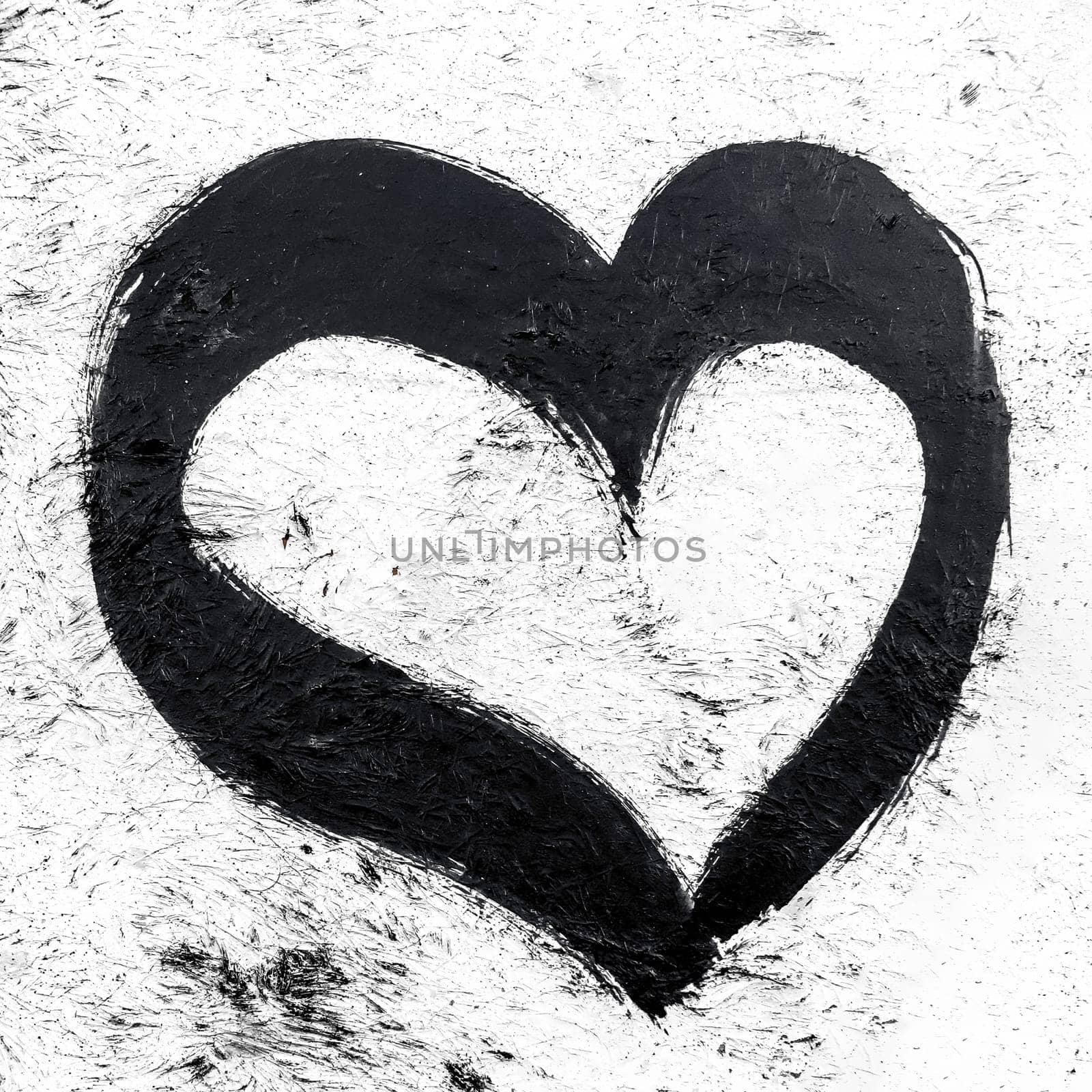 Image of a black heart on grungy wall. Empty copy space for inscription. It can be used as backgrounds and concepts.