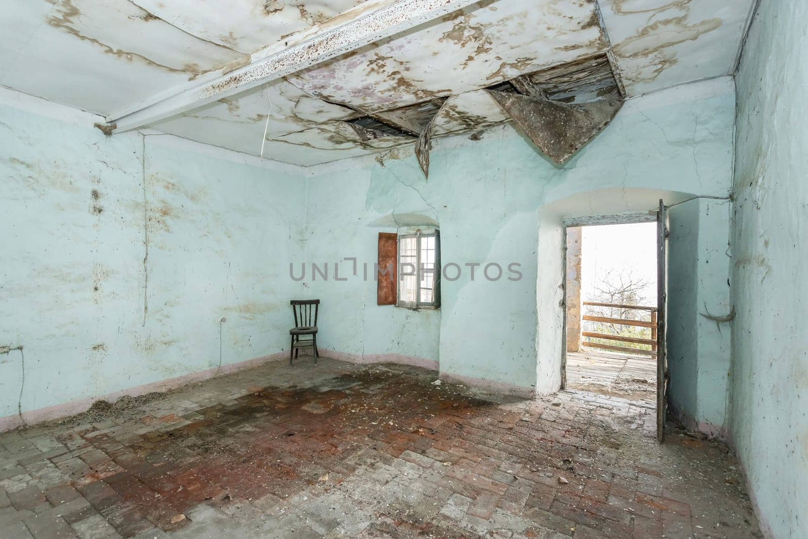 Old house to renovate. Creepy room scenery. Cracked walls and vintage italian floors along with a decay atmosphere.