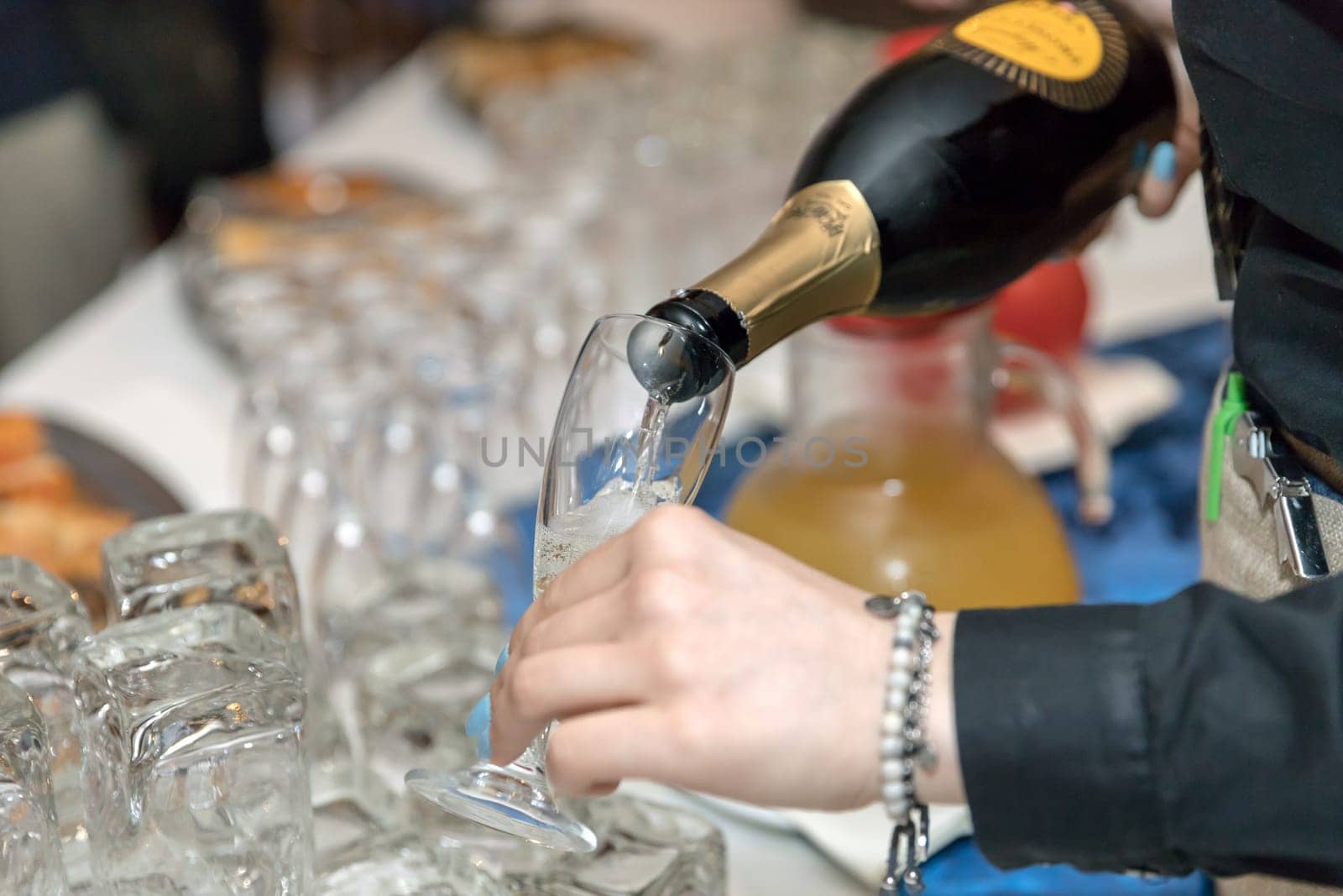 Prosecco bottle and glasses. Aperitif in restaurant party with friends, champagne celebration