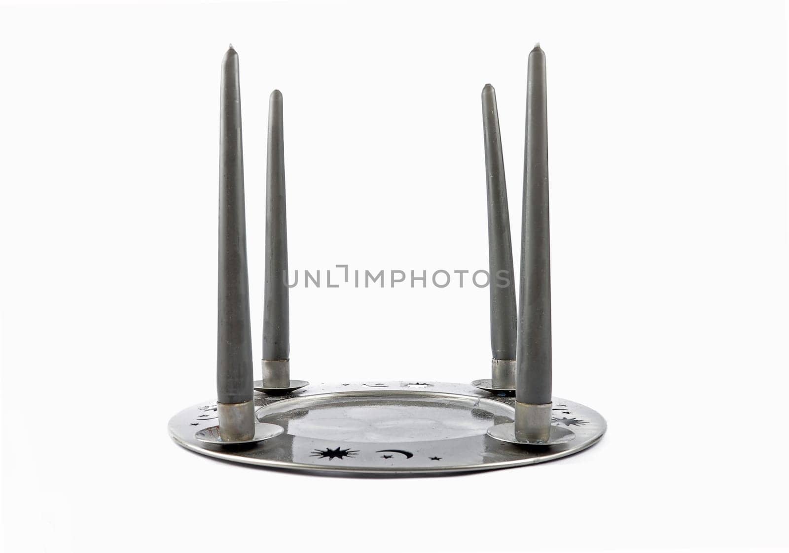 Tin plate as a candleholders on a white background