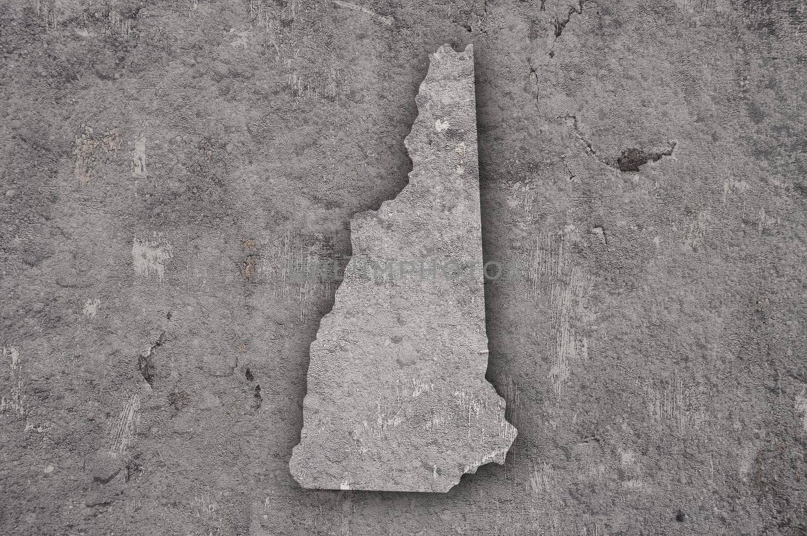 Map of New Hampshire on weathered concrete