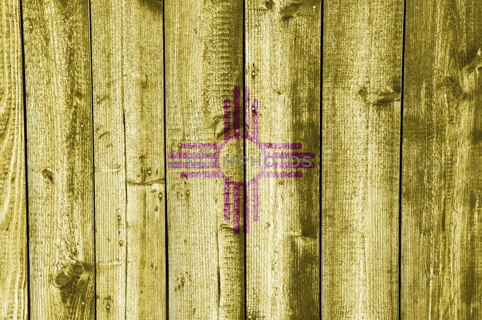 Flag of New Mexico on old wooden wall