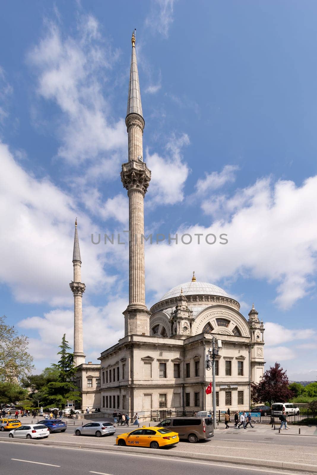Istanbul, Turkey - May 7, 2023: View from Meclis-i Mebusan Street overlooking Baroque style Dolmabahce Mosque, suited at the waterside of Kabatas, in Beyoglu district
