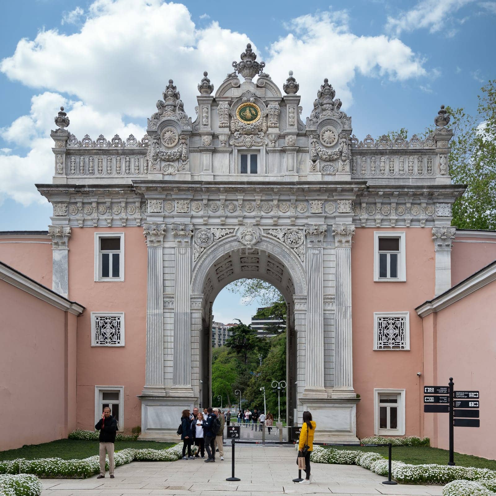 Istanbul, Turkey - May 10, 2023: Entrance of Dolmabahce Palace, with tourists visiting the place