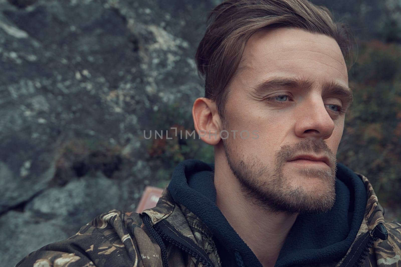Caucasian man in the mountain making selfie on background nature landscape